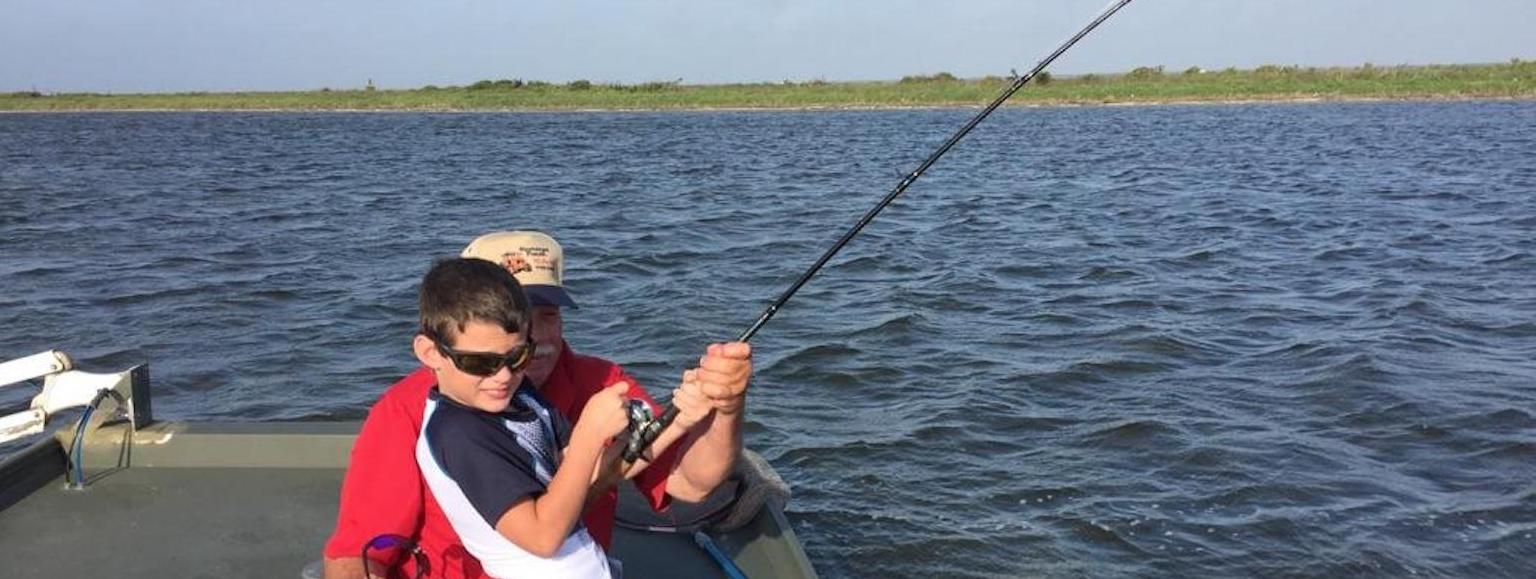 Boy and man fishing